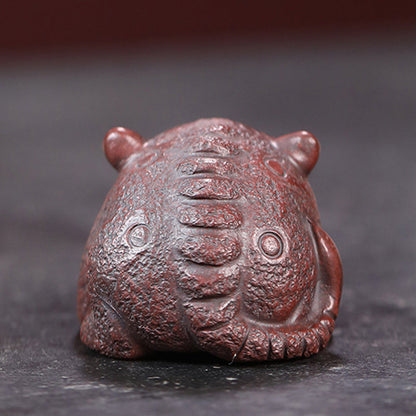 Goldschluckendes Tier Teehaustier